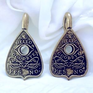 Silver Ouija board planchette earrings.